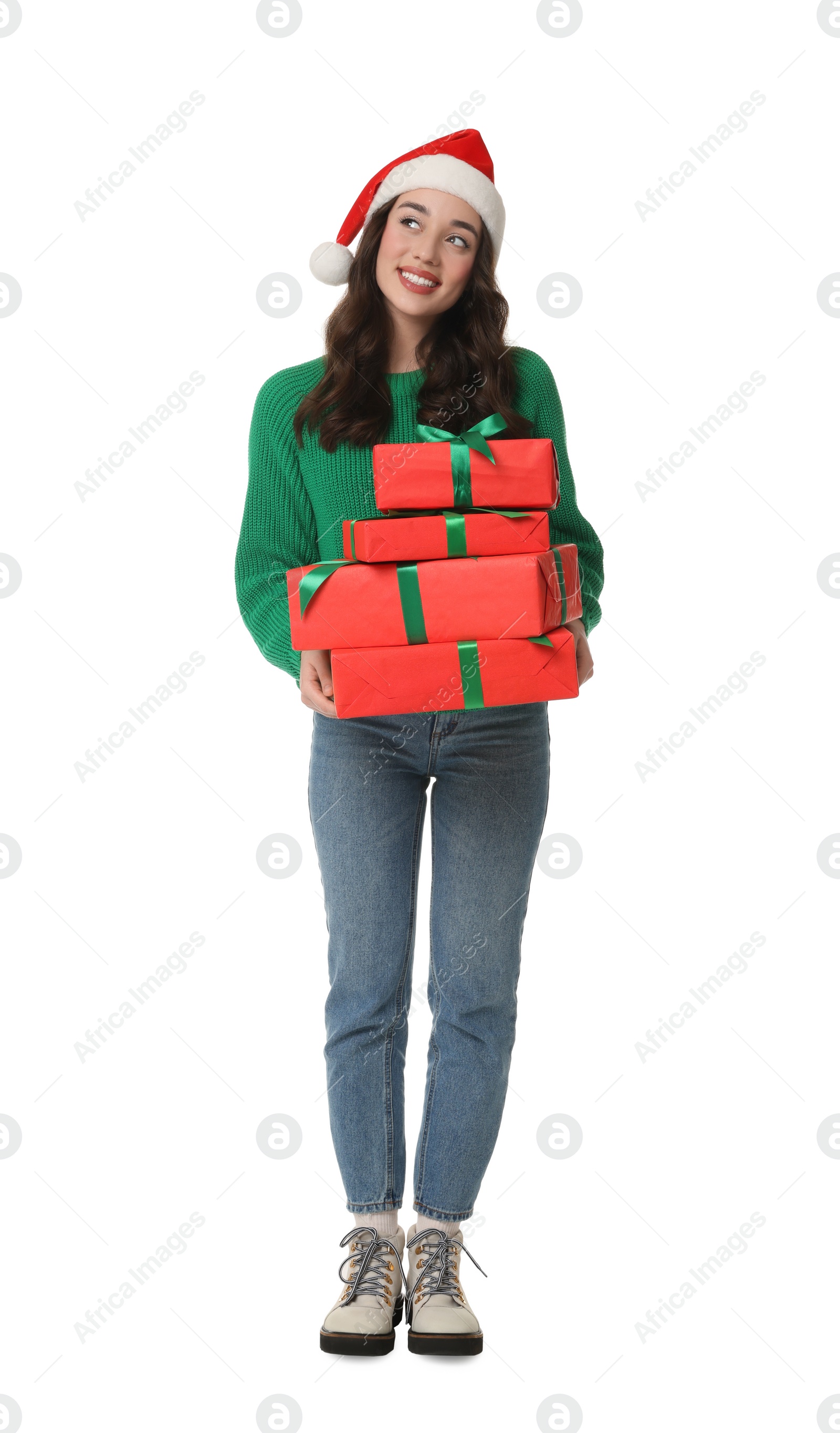 Photo of Beautiful young woman in Santa hat with Christmas gifts isolated on white