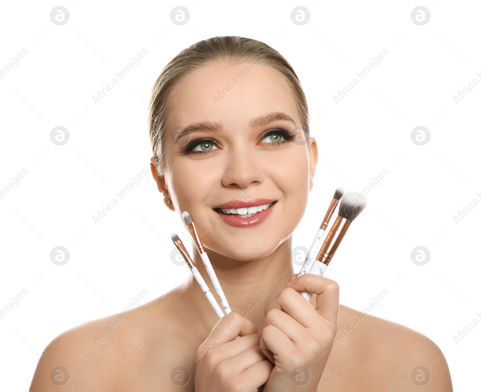 Photo of Beautiful woman with makeup brushes on white background