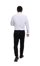 Photo of Businessman in formal clothes walking on white background, back view