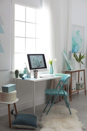 Photo of Stylish workplace interior with modern computer on desk