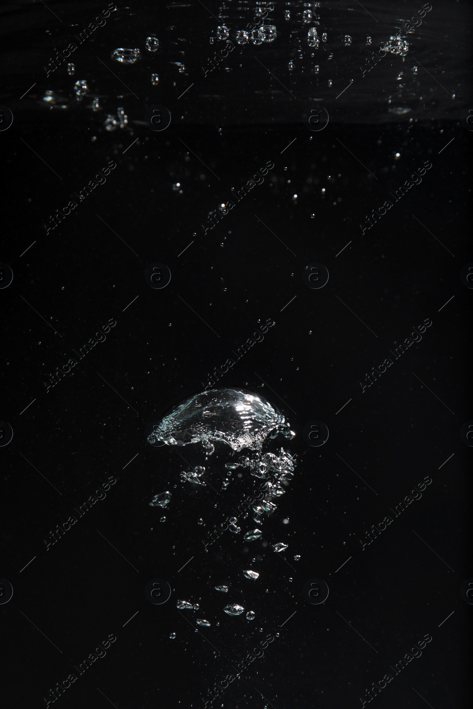 Photo of Air bubbles in water on black background