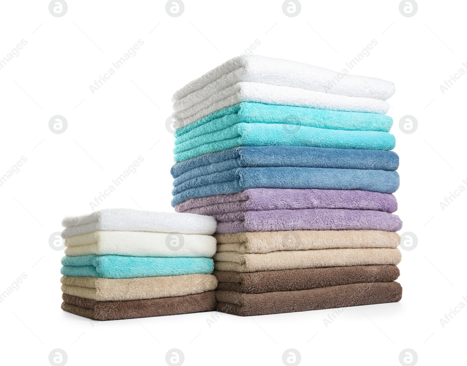 Photo of Different fresh soft terry towels on white background