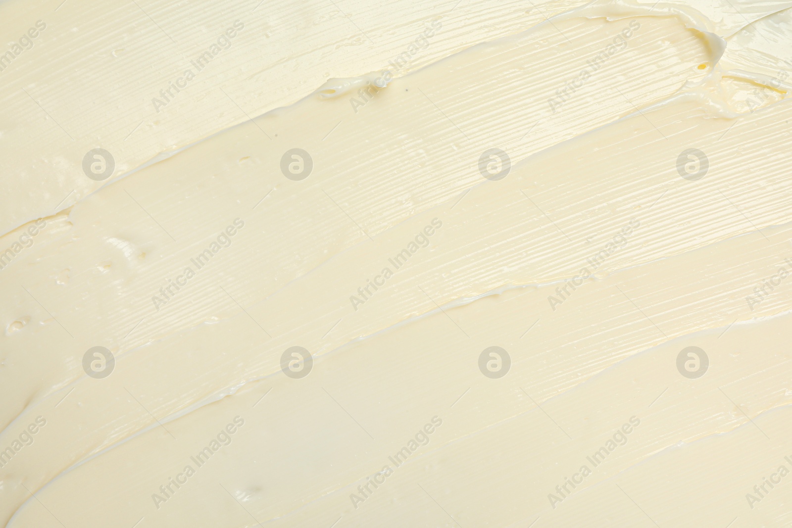 Photo of Texture of tasty butter as background, top view