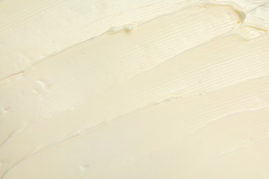 Photo of Texture of tasty butter as background, top view