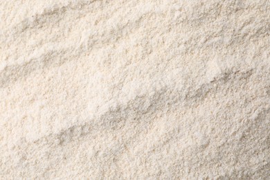 Photo of Heap of quinoa flour as background, closeup