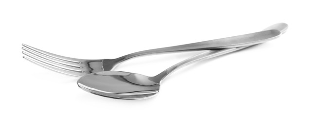Photo of Shiny fork and spoon on white background