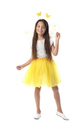 Cute little girl in fairy costume with yellow wings on white background