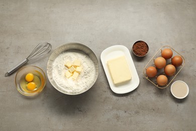 Photo of Flat lay composition with fresh butter and other products on grey textured table