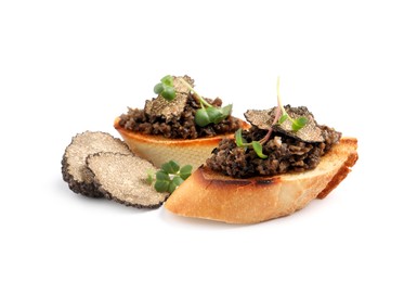 Tasty bruschettas with truffle paste on white background