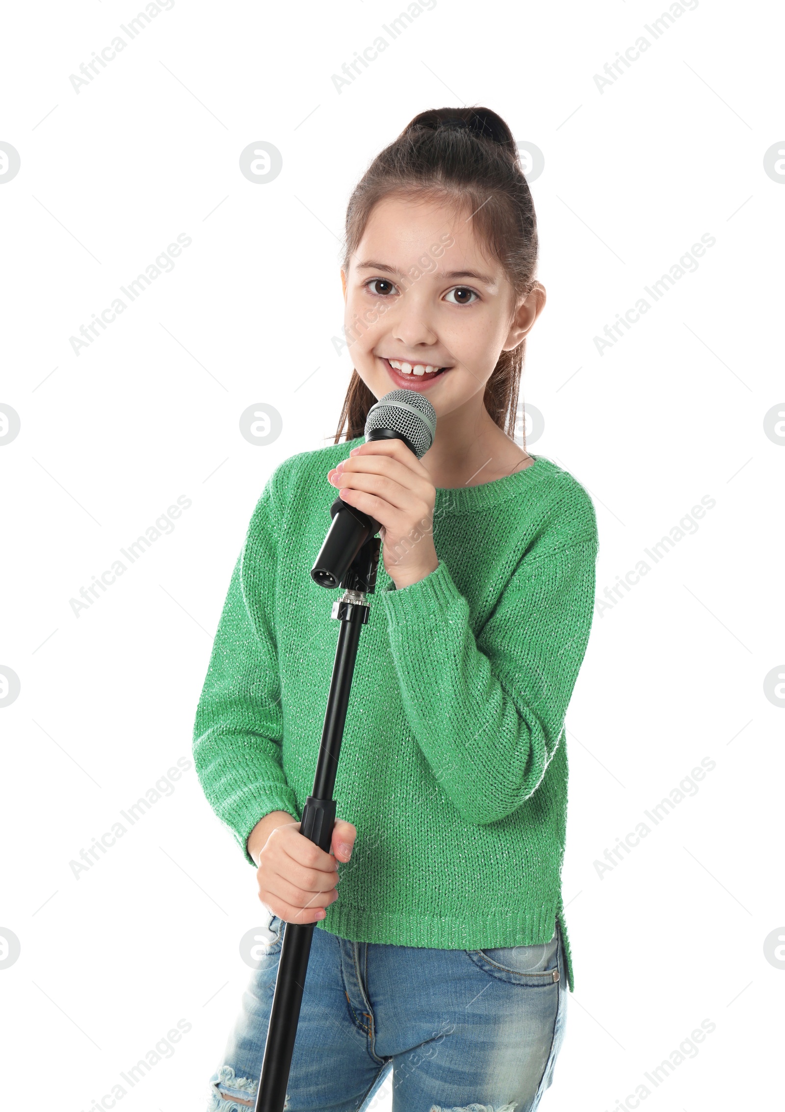 Photo of Little girl singing into microphone on white background