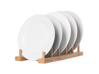 Photo of Many clean plates on wooden stand isolated on white