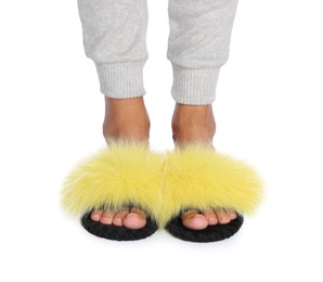 Photo of Woman in fluffy slippers on white background, closeup