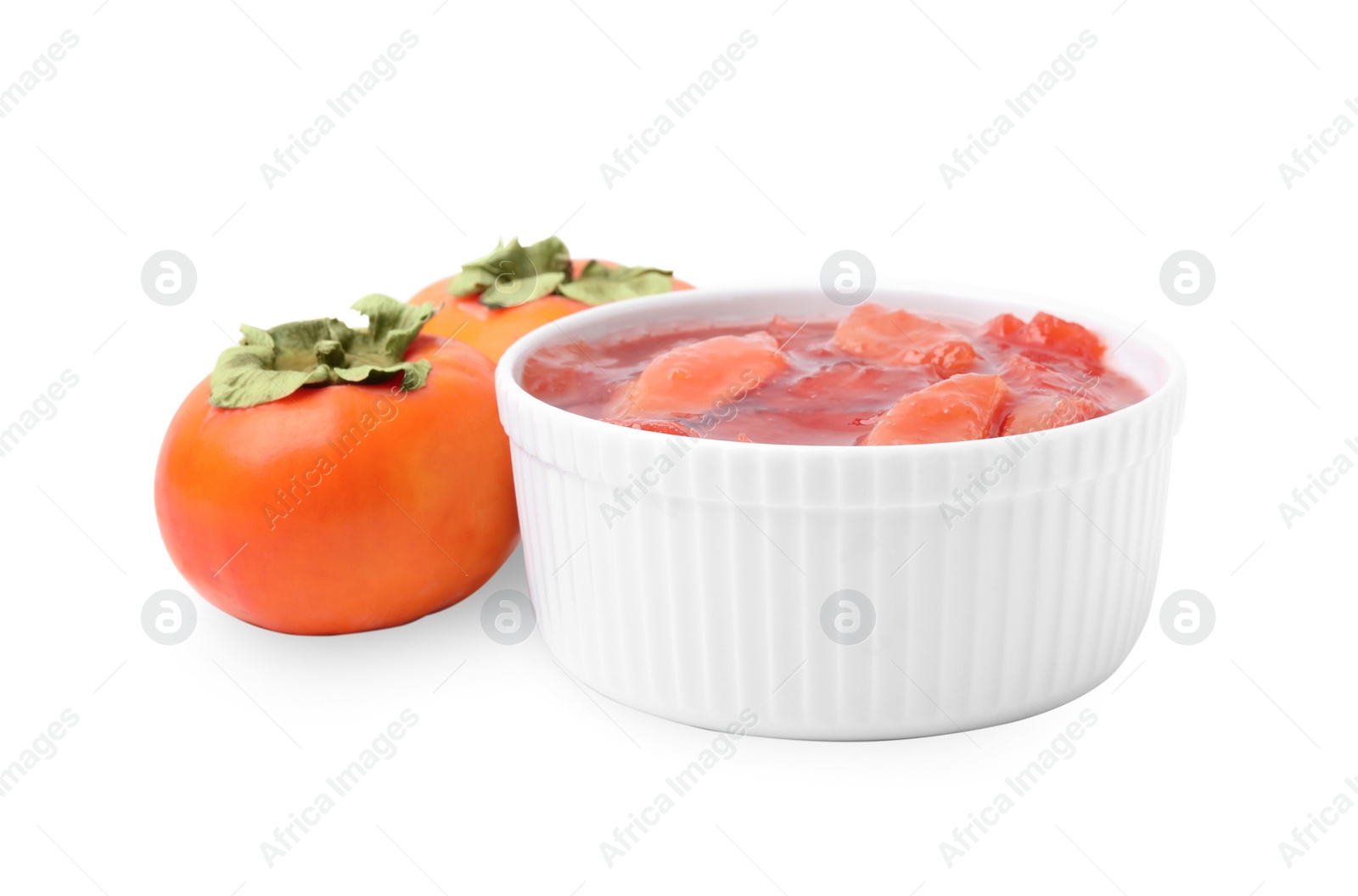 Photo of Bowl of tasty persimmon jam and fresh fruits on white background