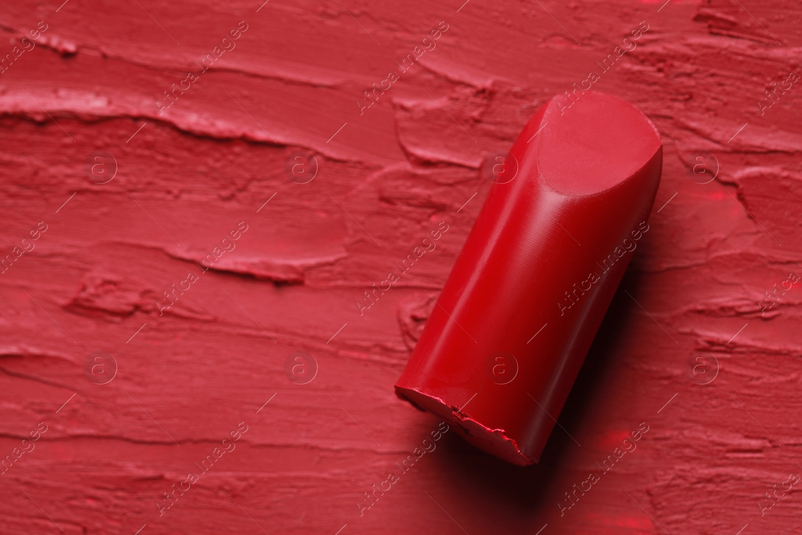 Photo of Beautiful red lipstick and smears, top view