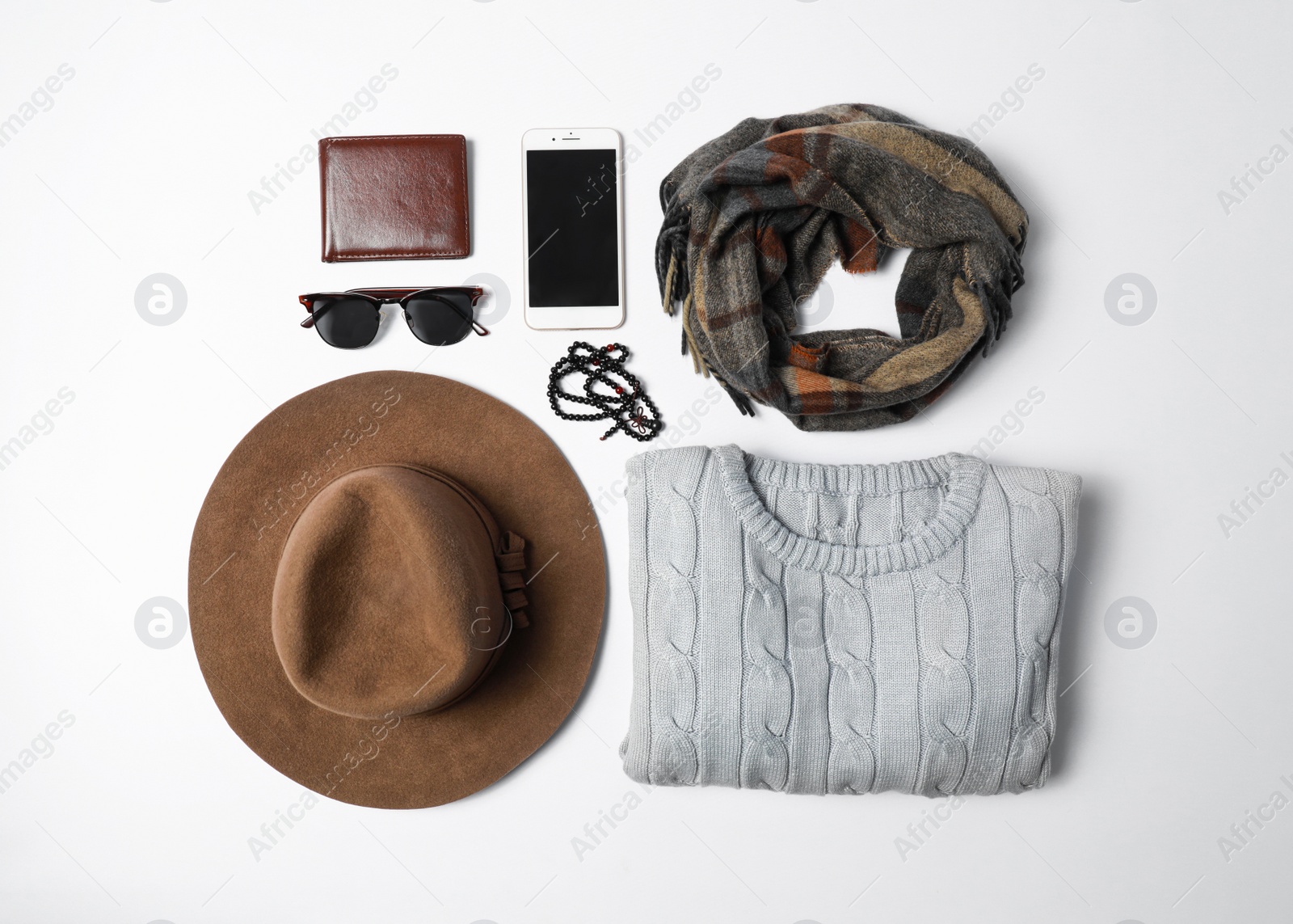 Photo of Stylish male autumn outfit and accessories on white background, flat lay. Trendy warm clothes