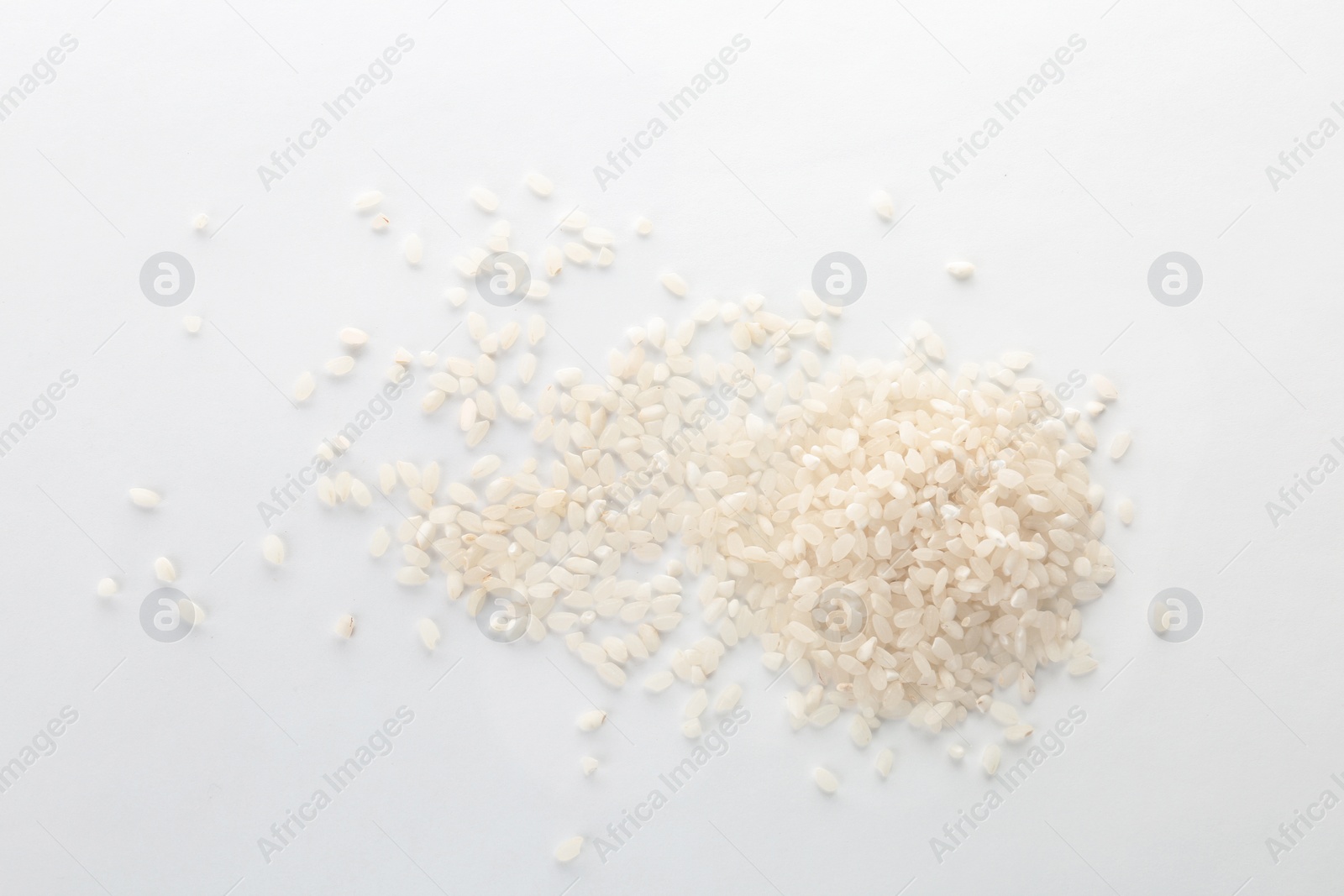 Photo of Raw rice on white background. Healthy grains and cereals