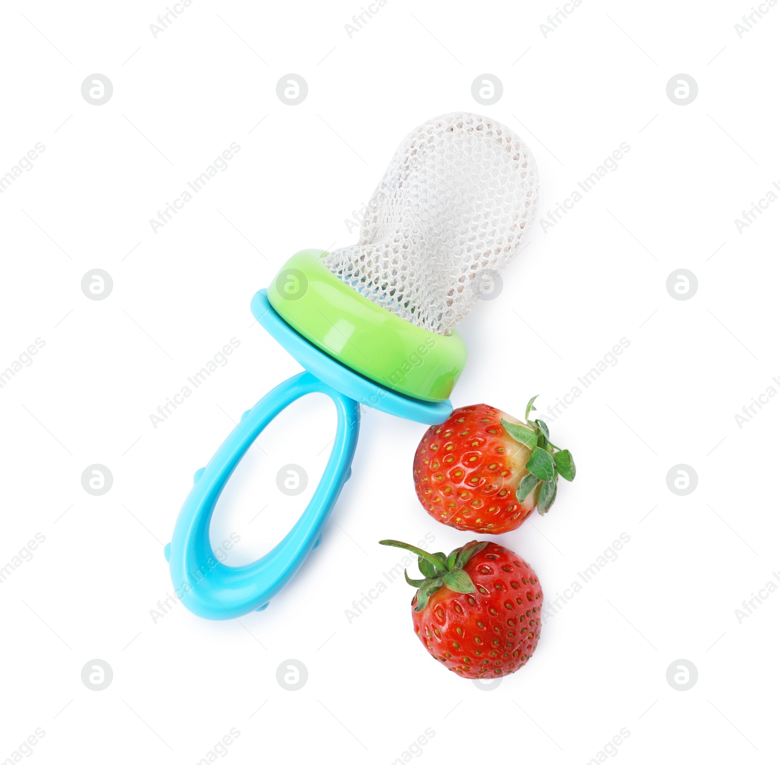 Photo of Empty nibbler and strawberries on white background, top view. Baby feeder