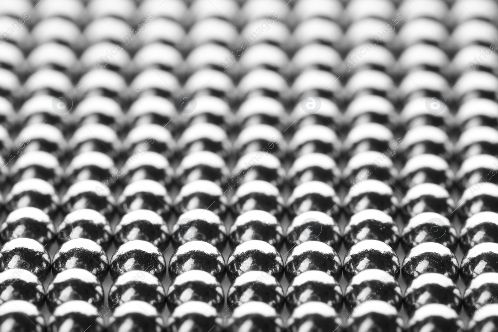 Photo of Small metal magnetic balls as background, closeup