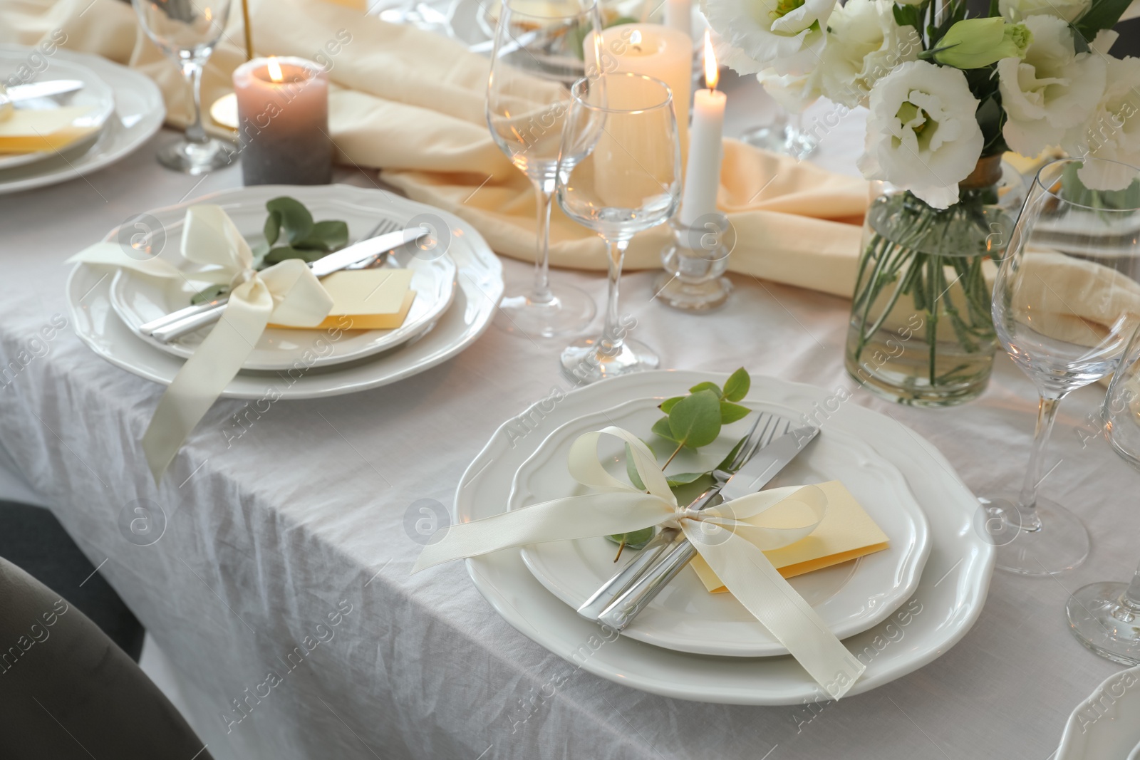 Photo of Festive table setting with beautiful floral decor in restaurant