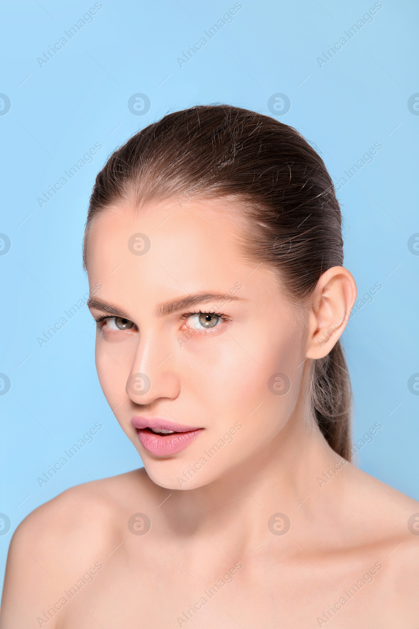 Photo of Beautiful woman with perfect eyebrows on color background