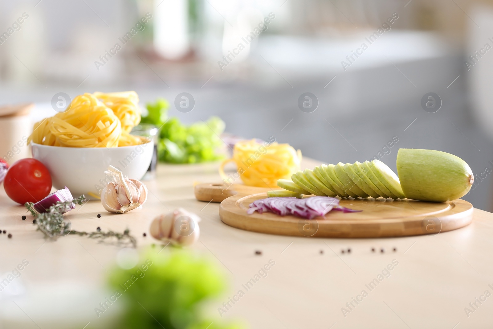 Photo of Fresh products and cutting board on kitchen table. Cooking healthy food