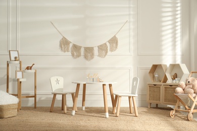 Photo of Modern child room interior with stylish furniture and accessories