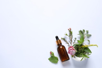 Photo of Bottle of essential oil, different herbs, rose flower and bud on white background, flat lay. Space for text