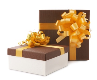 Photo of Beautiful gift boxes with bows on white background