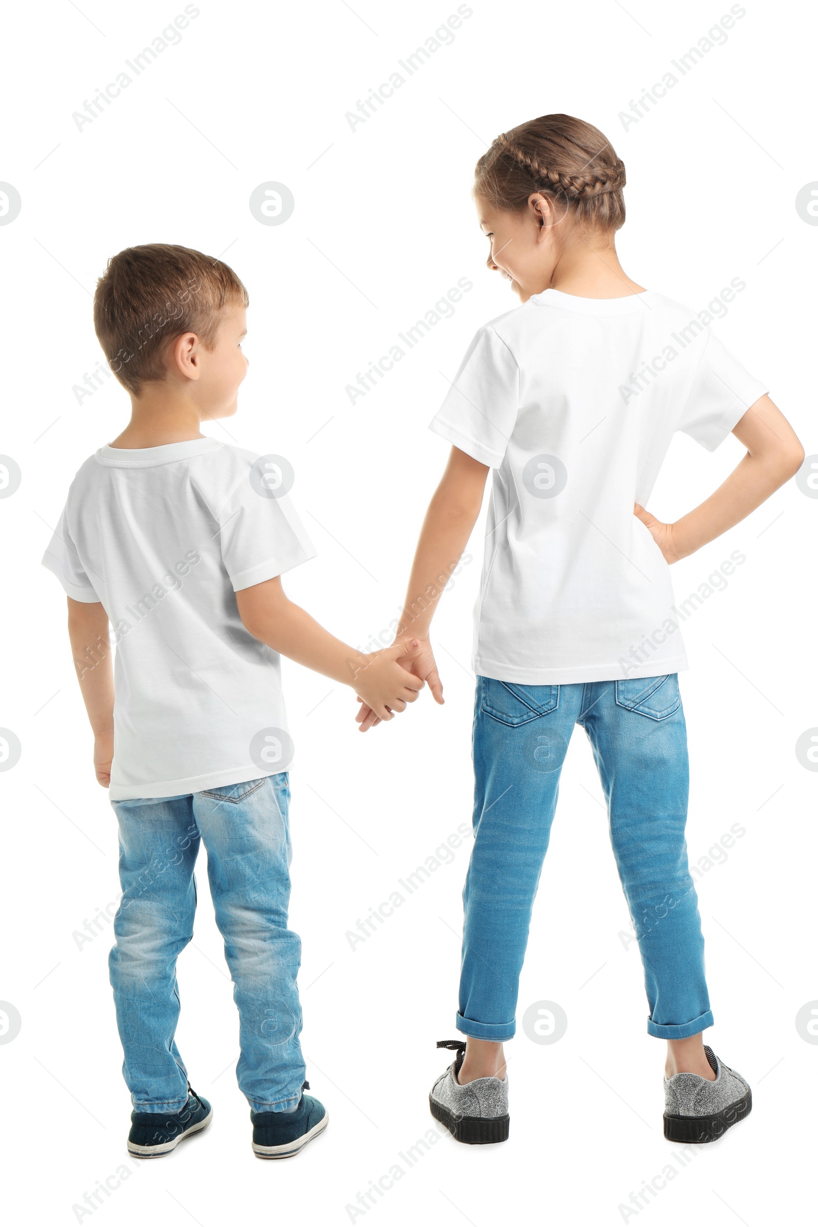 Photo of Little kids in t-shirts on white background. Mockup for design