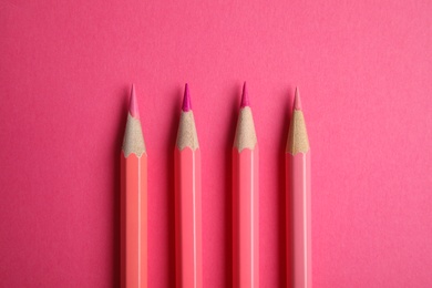 Photo of Flat lay composition with color pencils on pink background