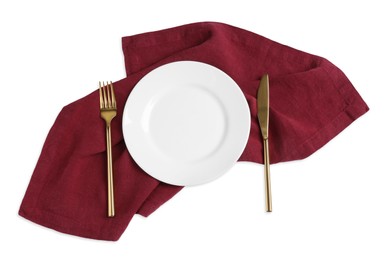 Photo of Empty plate, fork and knife on white background, top view