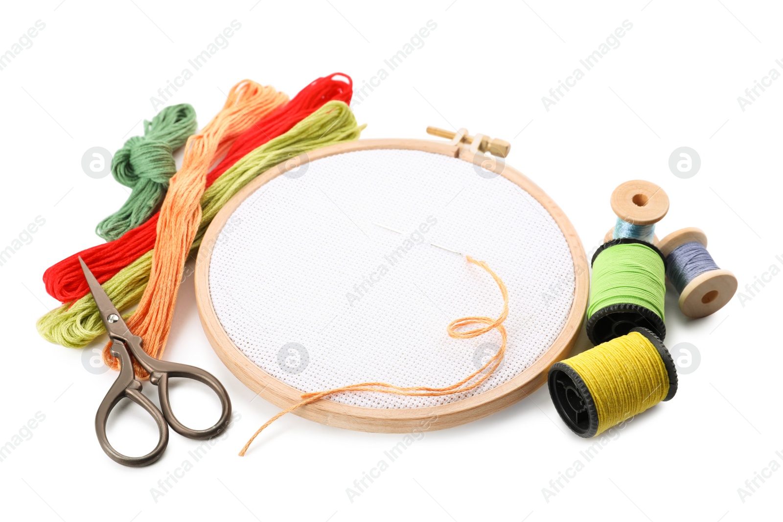 Photo of Set of embroidery equipment on white background