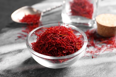 Photo of Dried saffron on grey marble board, closeup