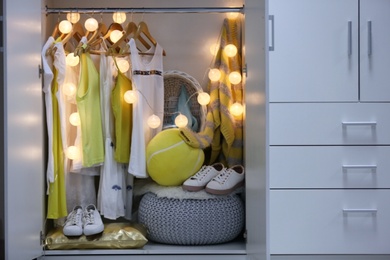 Women clothing on hangers in wardrobe