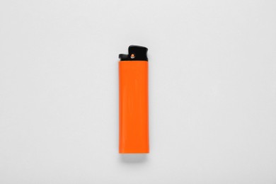 Stylish small pocket lighter on white background, top view