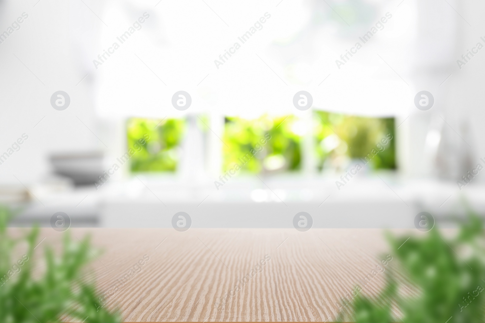 Wooden table in light kitchen. Space for design Image of Wooden table in light kitchen. Space for design