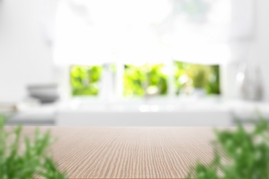 Image of Wooden table in light kitchen. Space for design