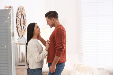 Happy couple spending time together at home. Winter vacation