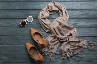 Photo of Flat lay composition with clothes on dark wooden background