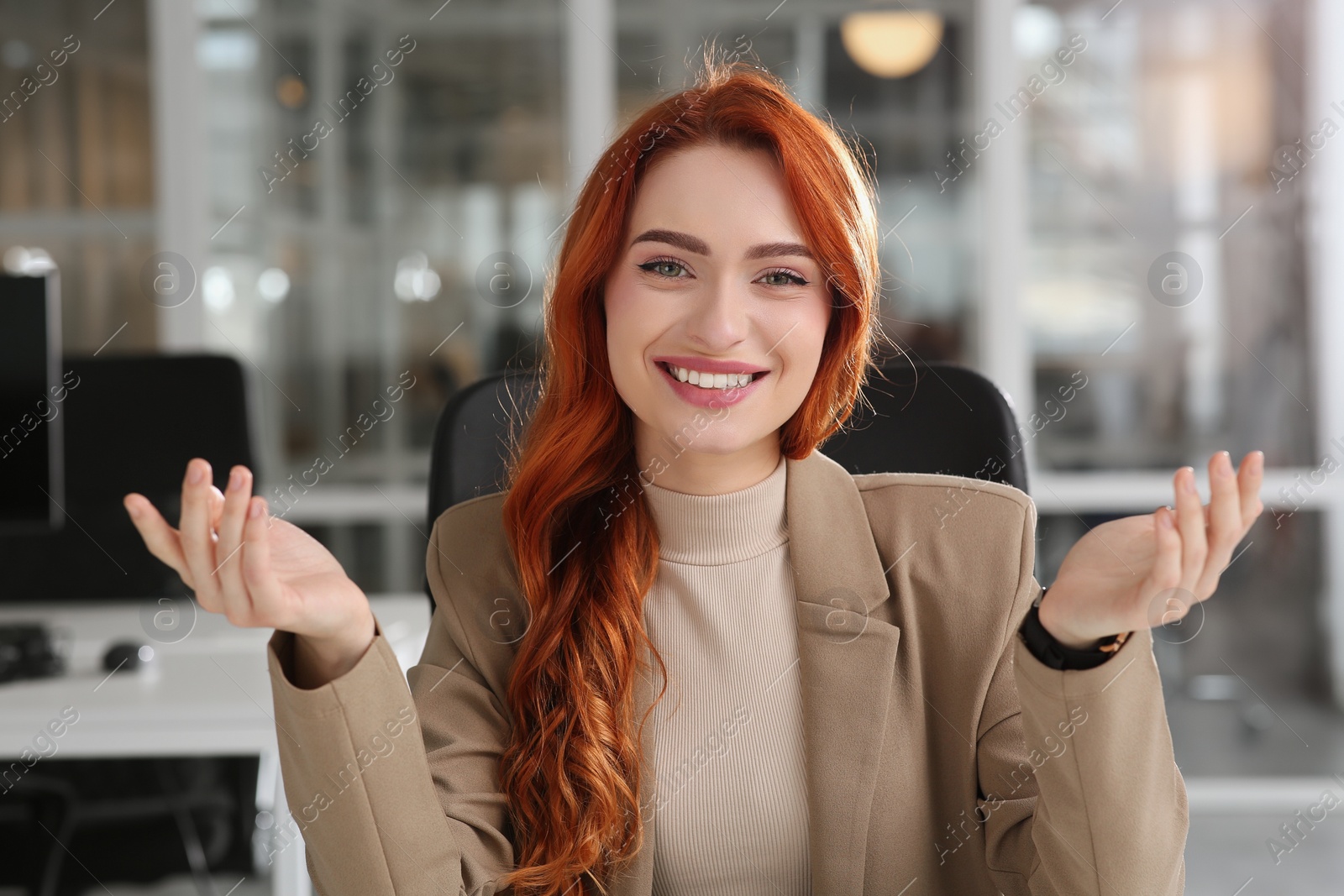 Photo of Happy woman having video call in office, view from web camera