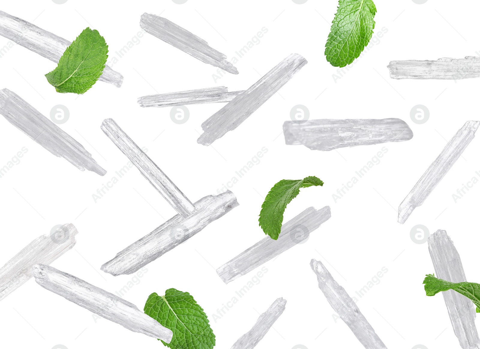 Image of Translucent menthol crystals and green mint leaves falling on white background 