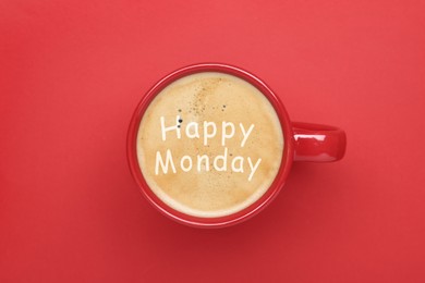 Happy Monday. Cup of aromatic coffee on red background, top view