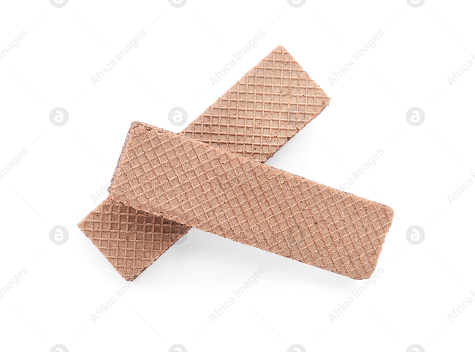 Photo of Delicious crispy wafers on white background, top view. Sweet food