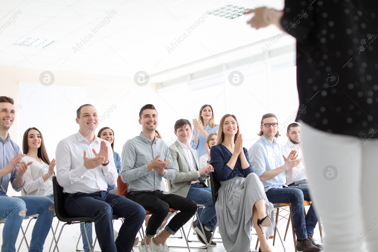 Photo of Young people having business training in office