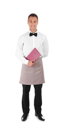 Young waiter with menu on white background