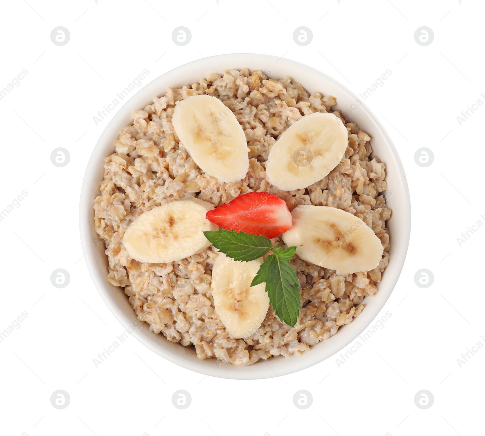 Photo of Tasty boiled oatmeal with strawberry and banana in bowl isolated on white, top view