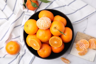 Photo of Fresh juicy tangerines on white marble table, flat lay