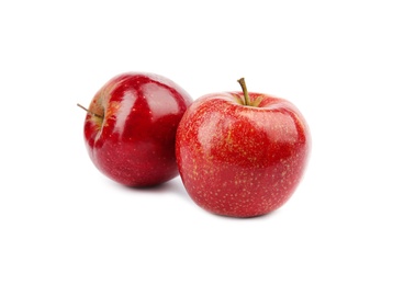 Ripe juicy red apples on white background