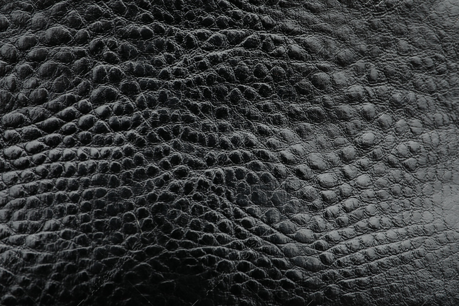 Photo of Texture of black leather as background, closeup