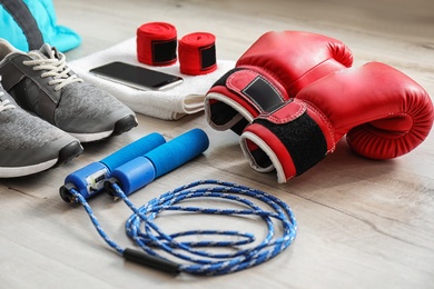 Photo of Composition with sports bag on wooden floor